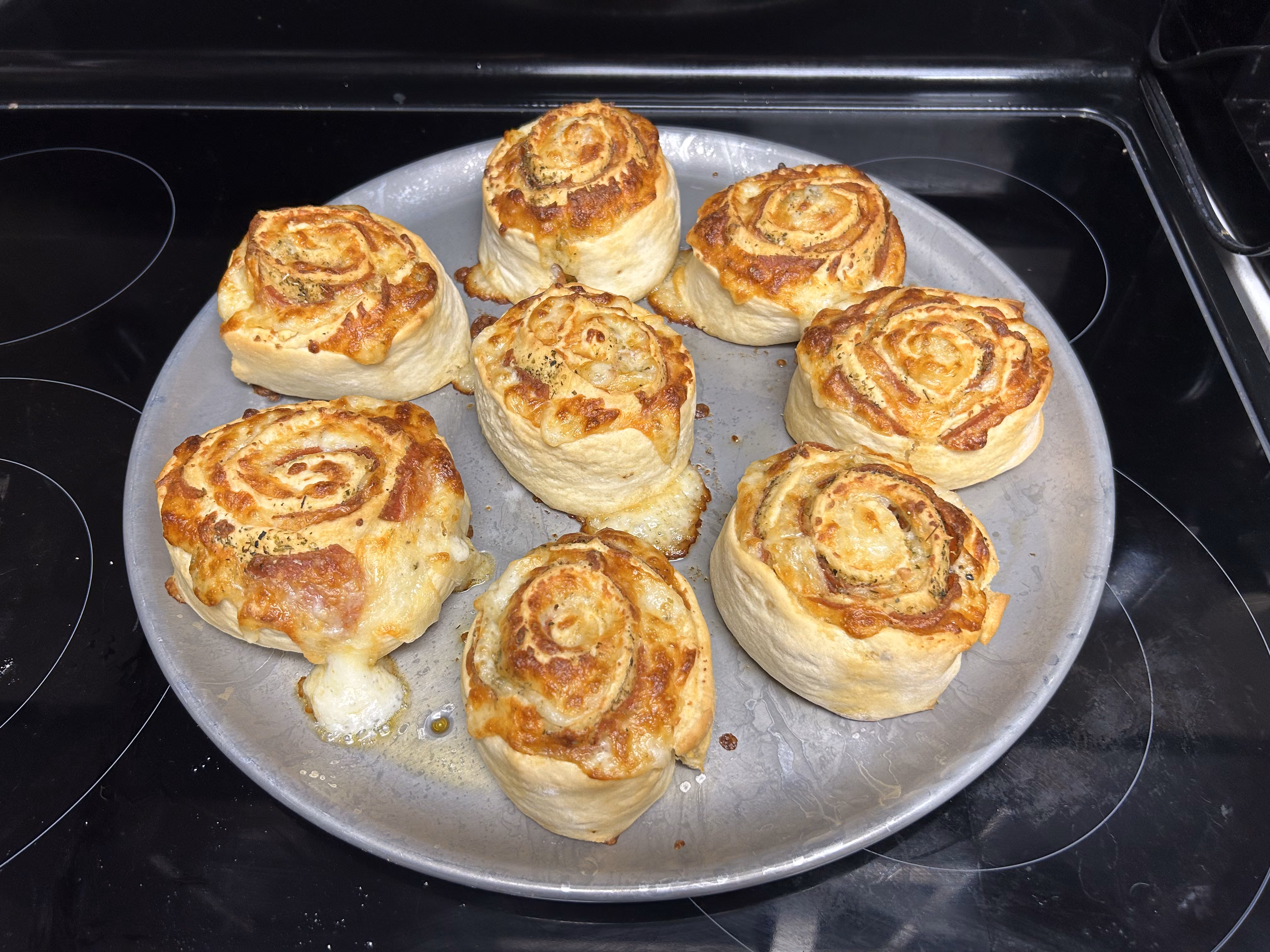 Pizza buns on a baking sheet, fresh out of the oven